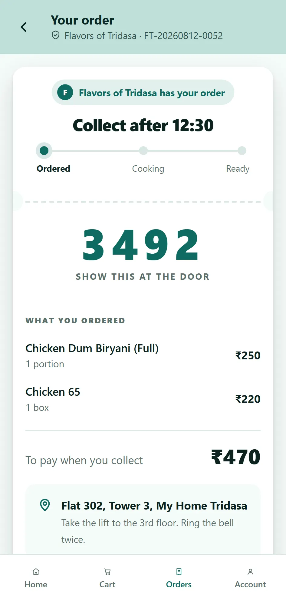 The order ticket: a large pickup code, what was ordered, where and when to collect it, and how much to pay at the door.